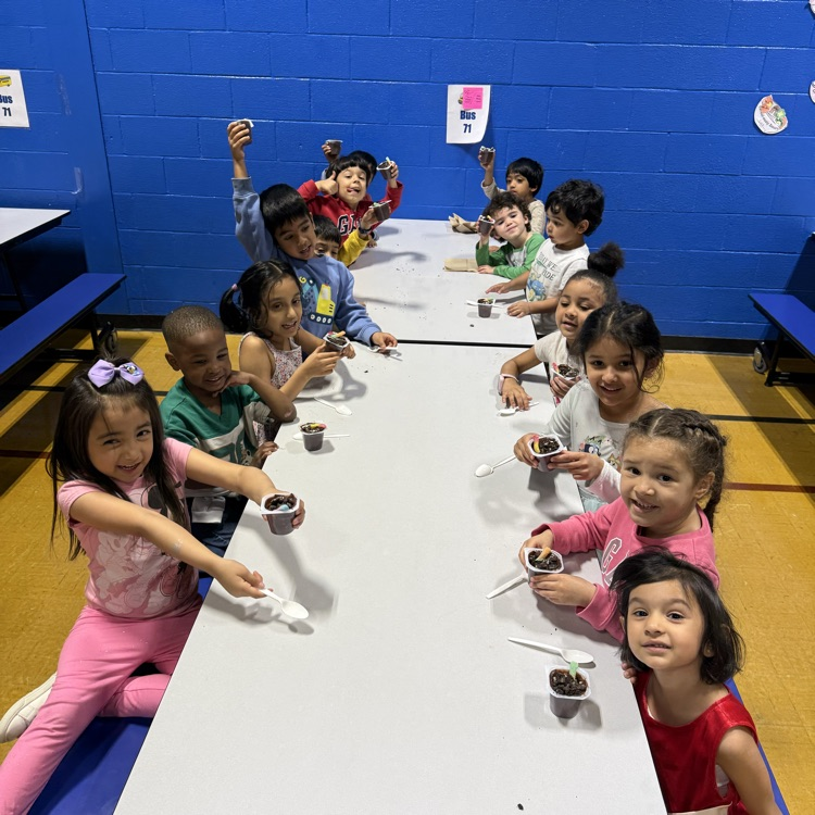 Kids sitting at a cafeteria table