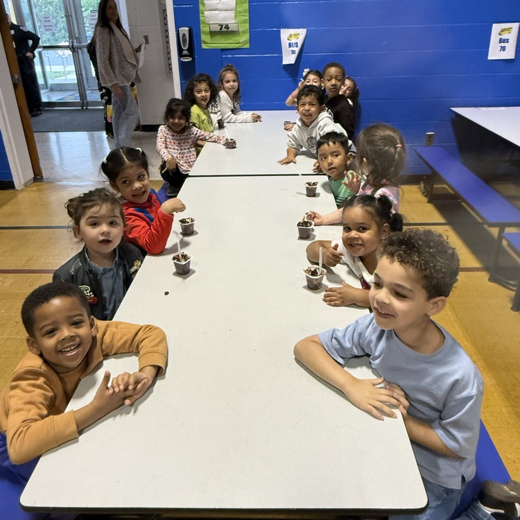 Kids sitting at a cafeteria table