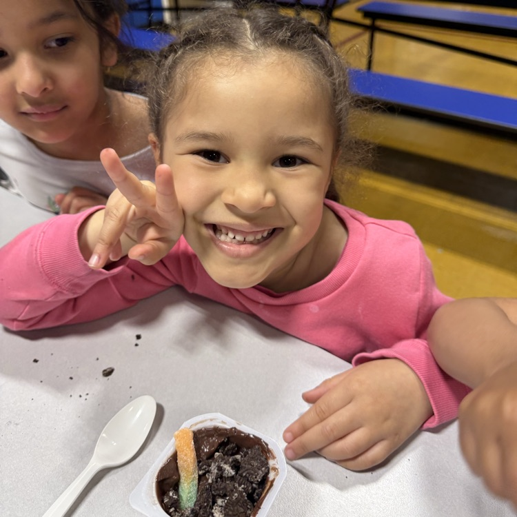 Kids sitting at a cafeteria table