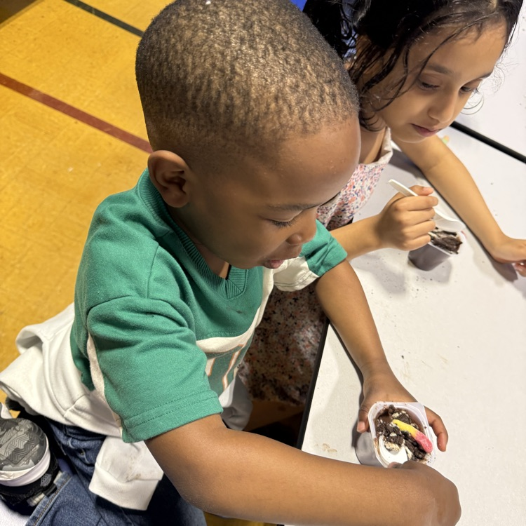 Kids sitting at a cafeteria table