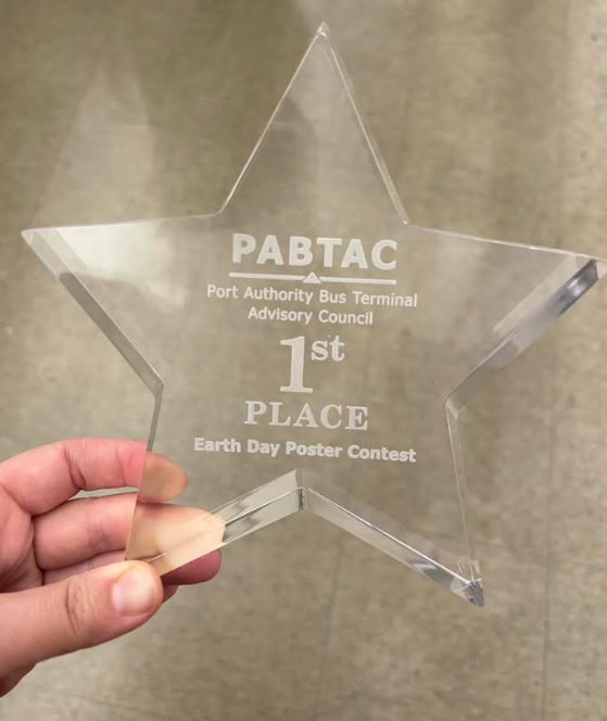 Glass star trophy with 1st place Earth Day Poster Contest written on it