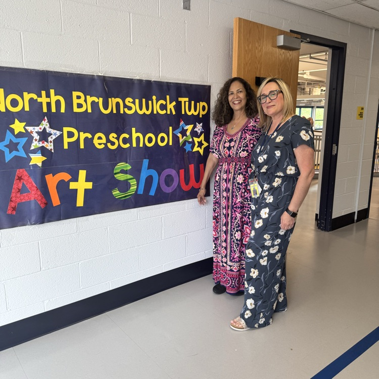 4th Annual Preschool Art Show  banner with teachers standing next to i