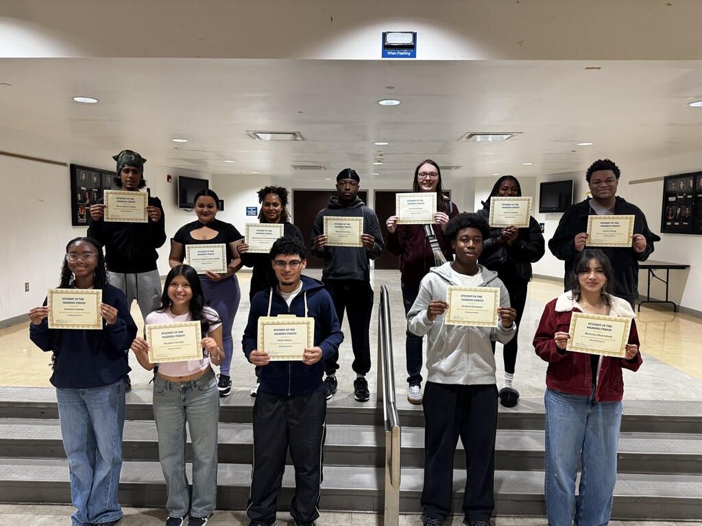 Students of Marking Period 3 standing together and holding certificates