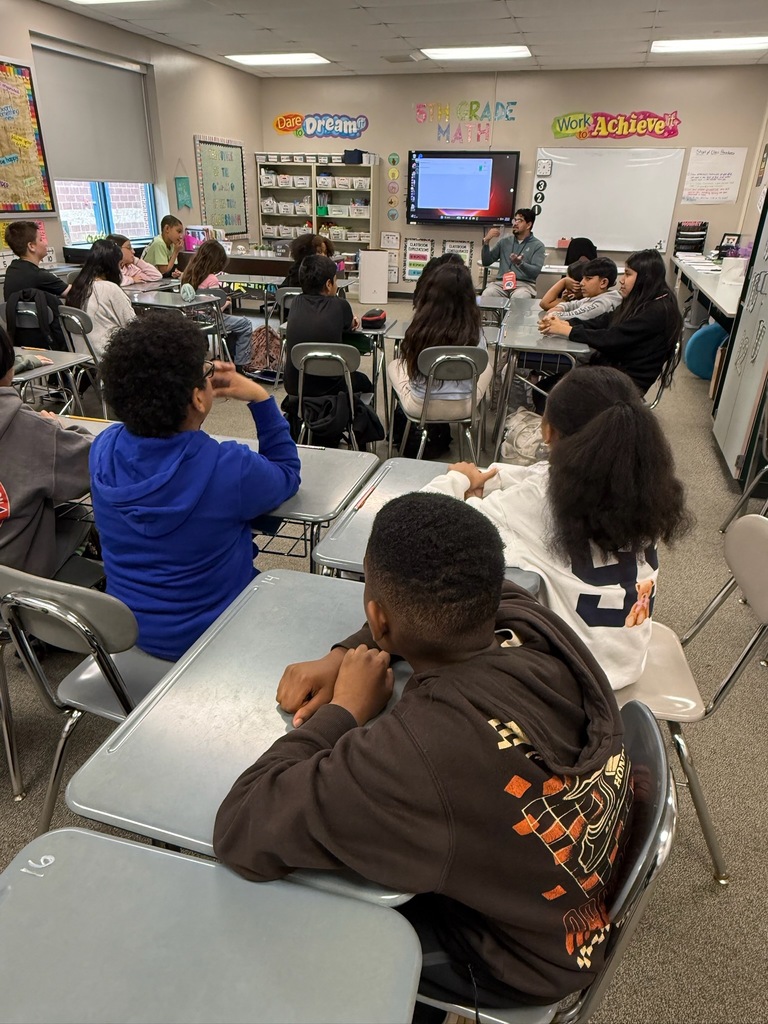 Students listening to presenter