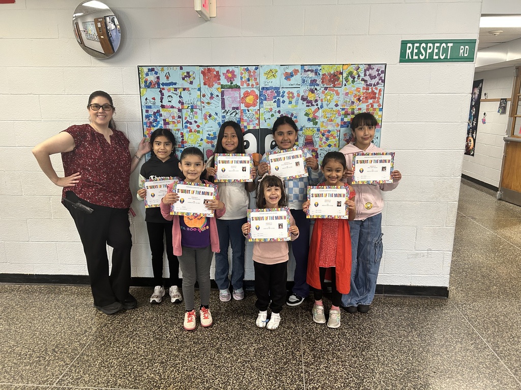 Group of students standing with certificates with the principal