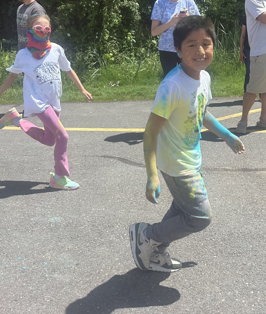 Students running with color all over them