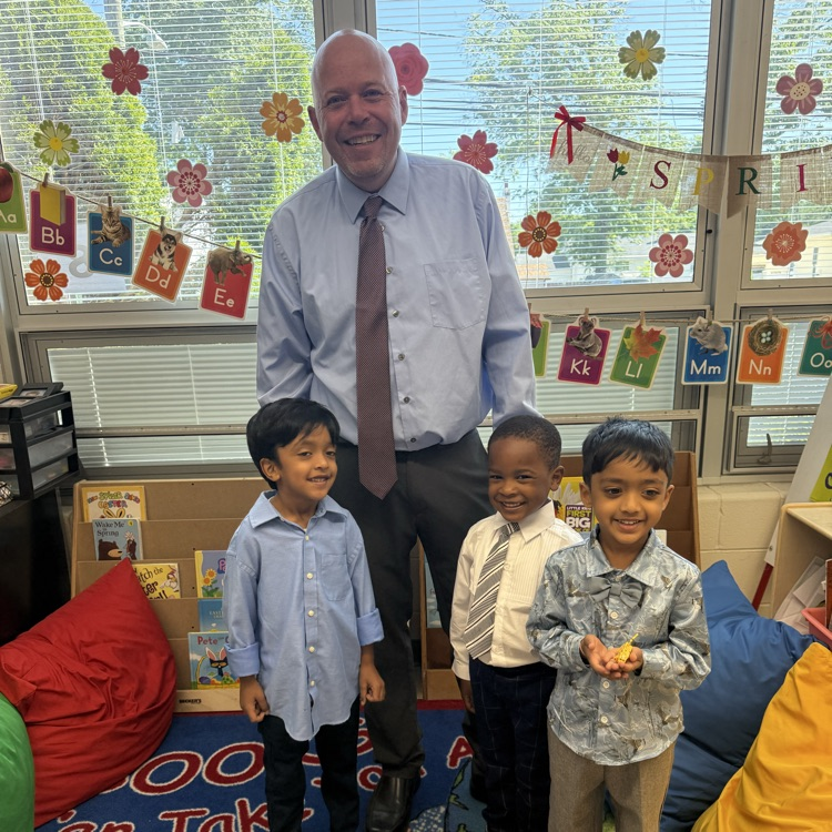 Students posing with principal