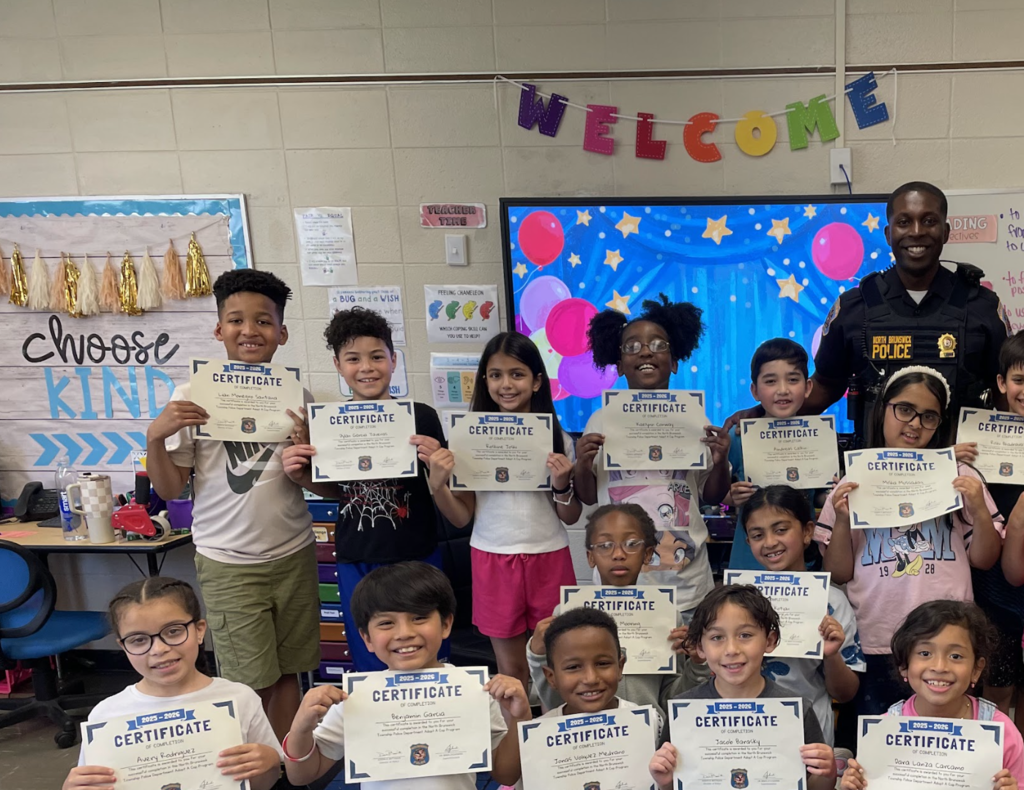 Students posing with certificates