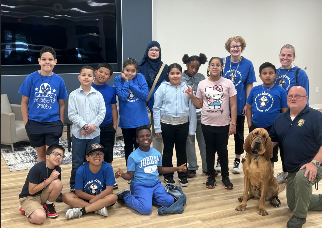 Students posed with a k-9 and officer