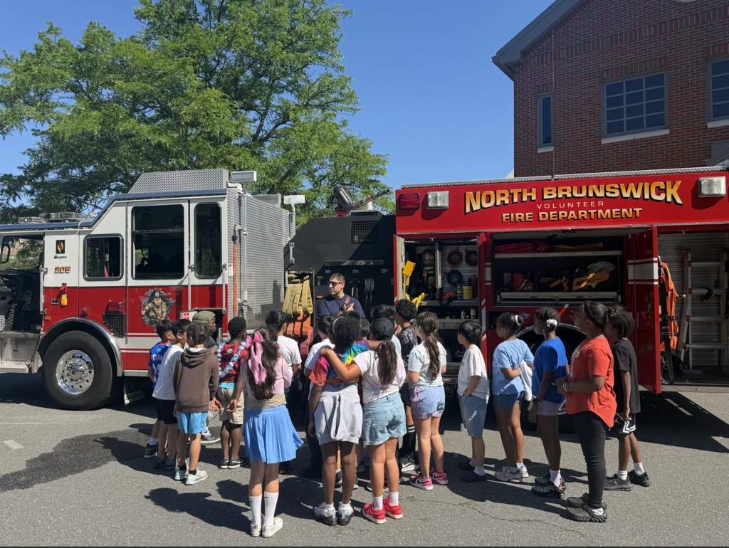 Students listening to a firefighter speak