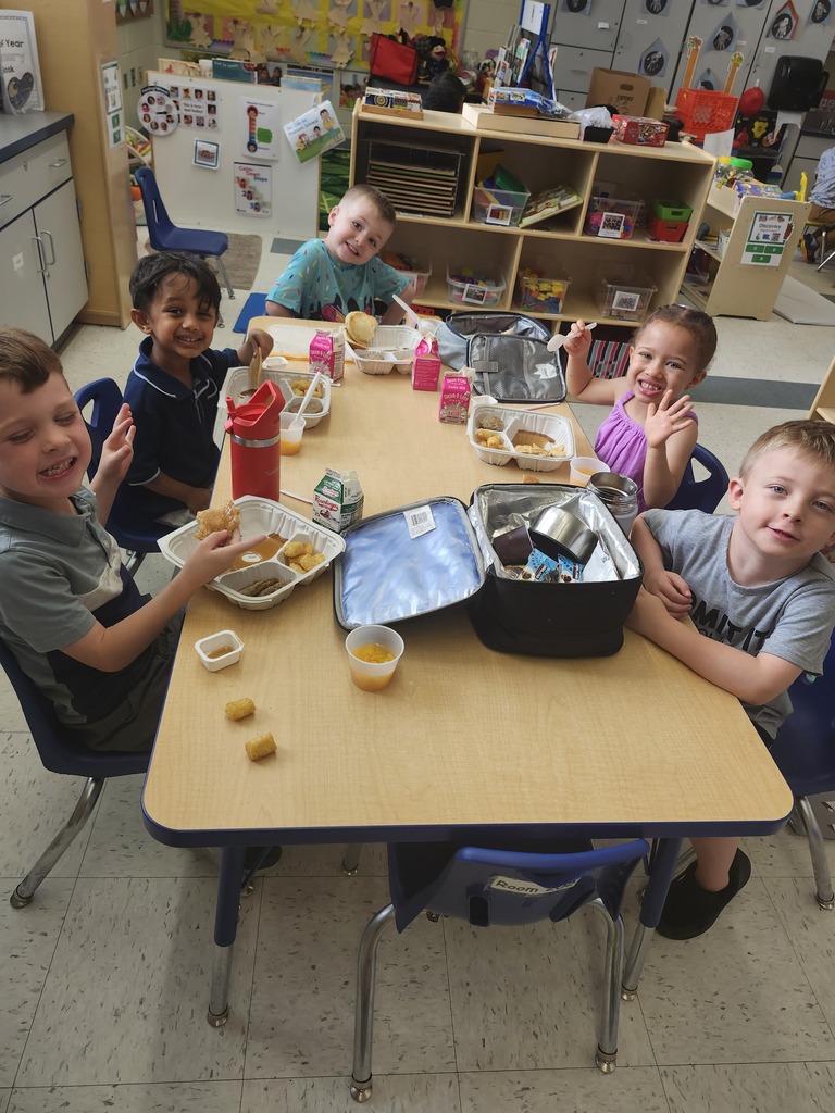 Students eating lunch at a table
