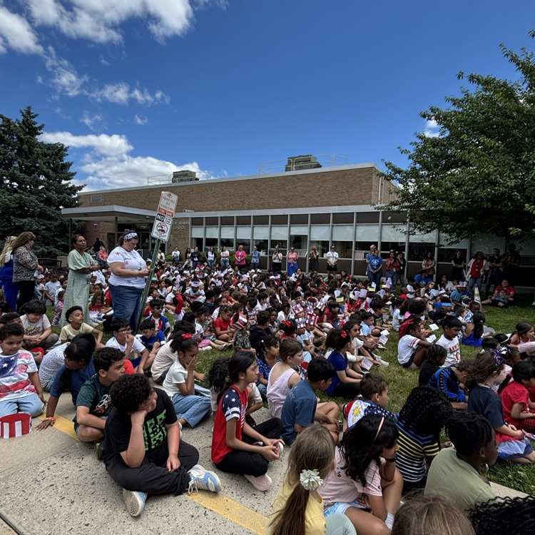 students at a flag day assembly