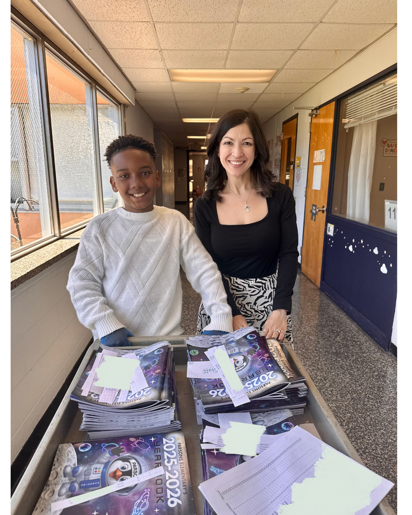 Student posing with teacher