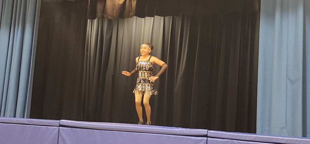 Student performing on stage