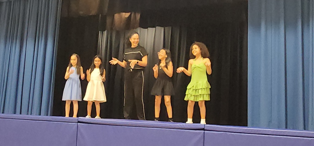 Students performing on stage