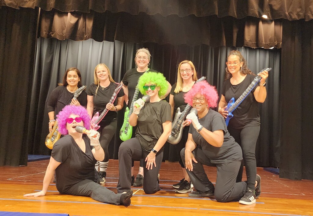 staff performing on stage