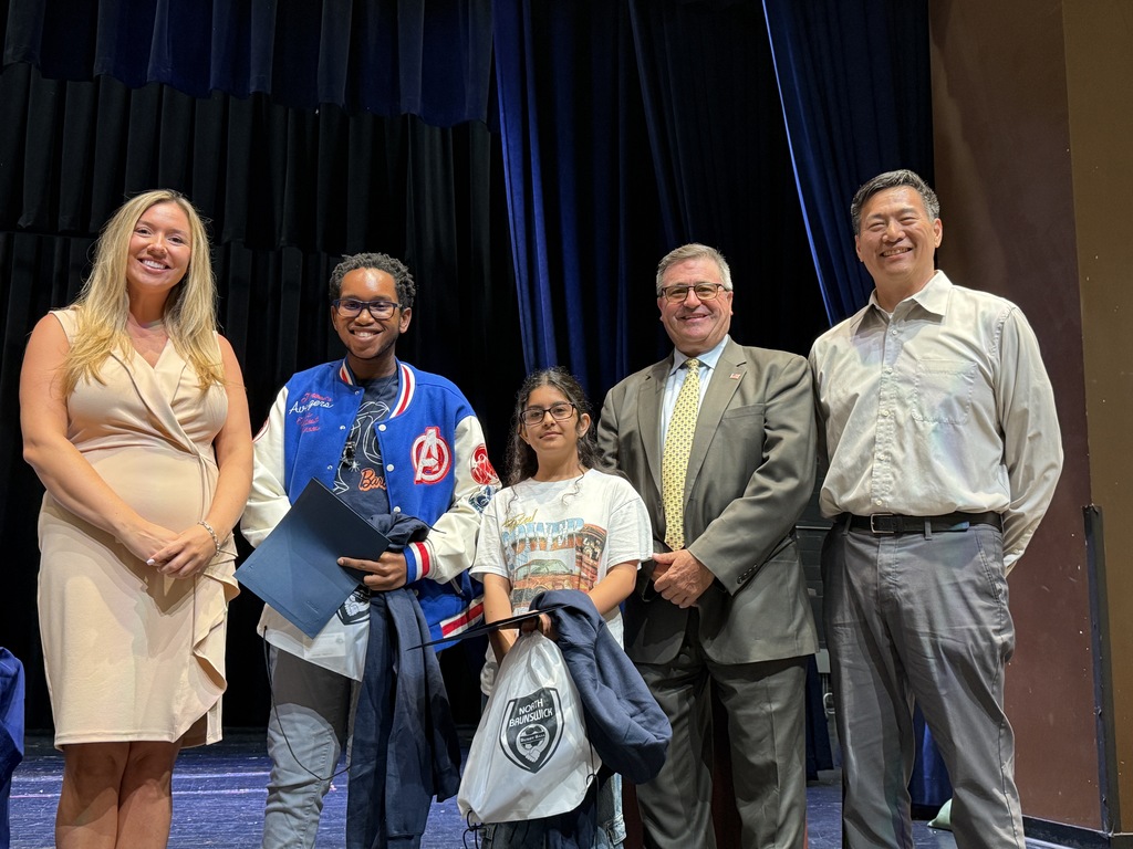Students receiving award recognitions from BOE