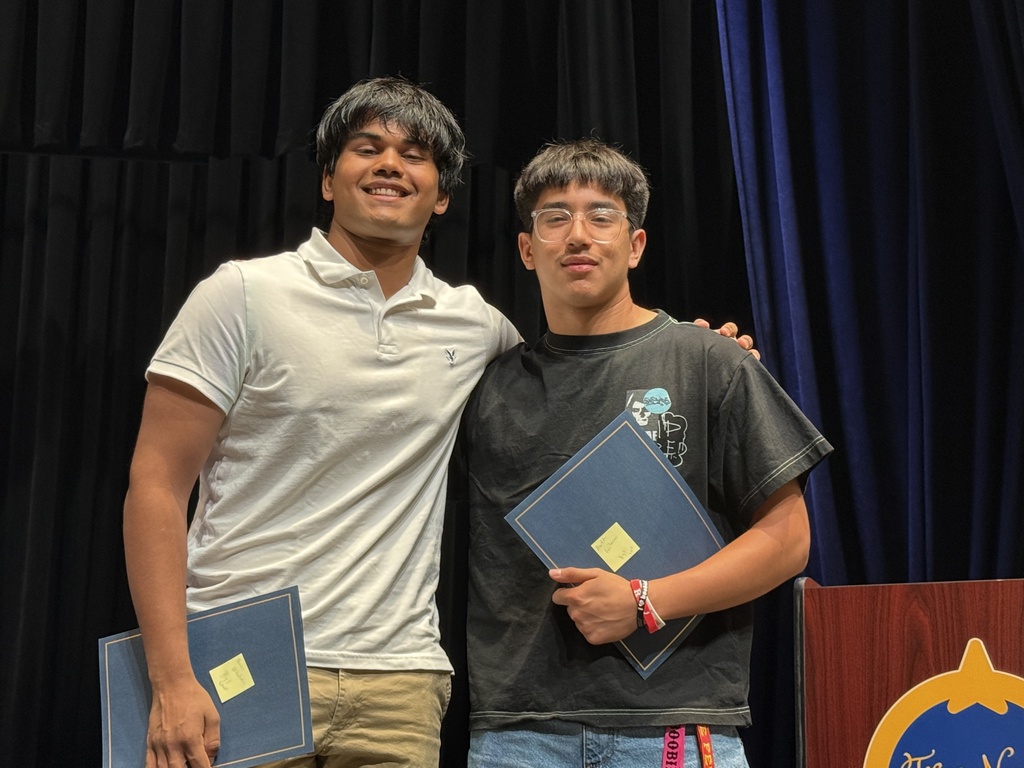 Students receiving award recognitions from BOE