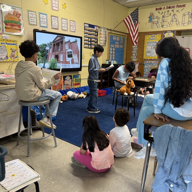Students performing in front of classmates