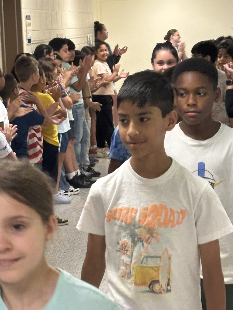 Students being clapped on 