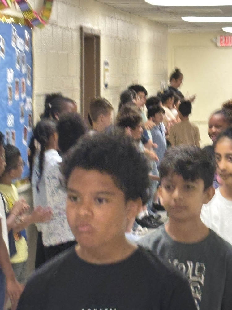Students being clapped on 