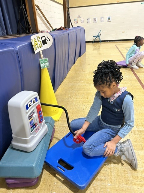 Students playing games in a gymnasium