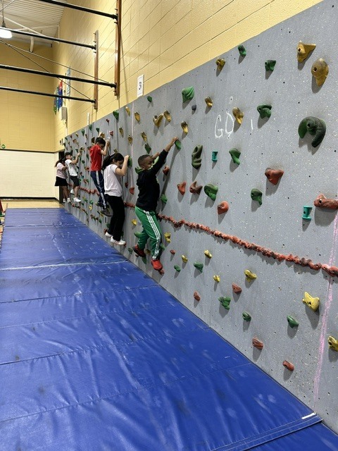Students playing games in a gymnasium