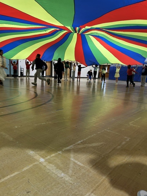 Students playing games in a gymnasium