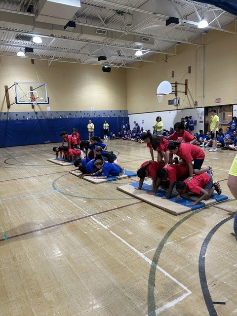 Students playing games in a gymnasium