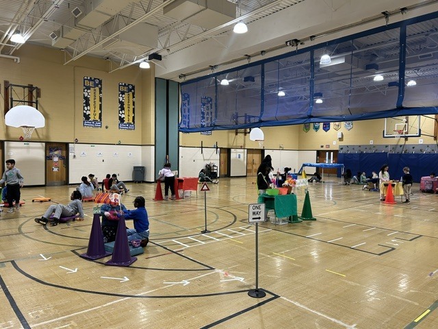 Students playing games in a gymnasium