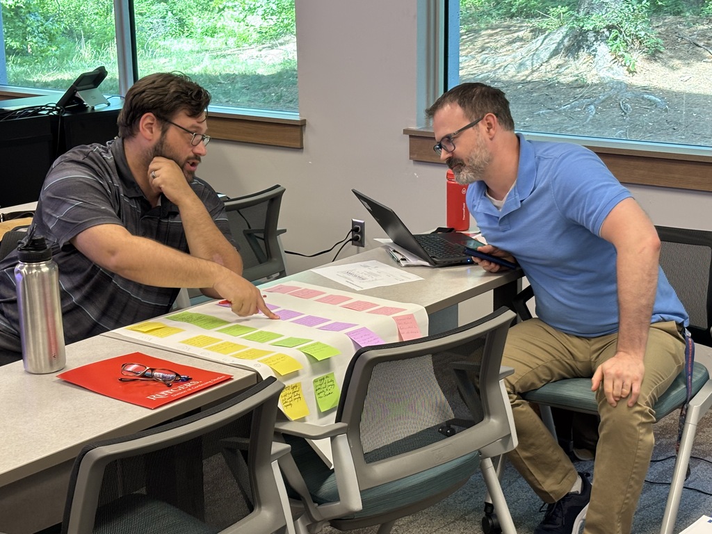 Science Teachers Discussing  A New Physics Unit