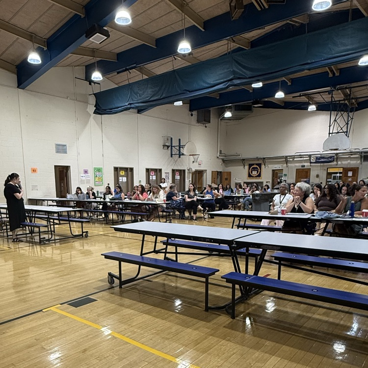 Teacher meeting in a cafeteria
