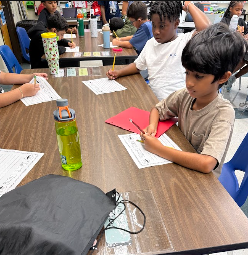 Student writing thank you letters