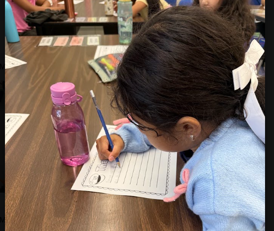 Student writing thank you letters