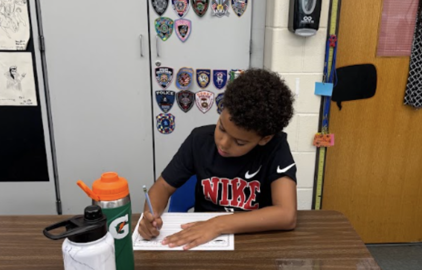 Student writing thank you letters