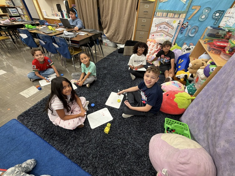 students in Mrs. Del Borrello’s class are working in stations and establishing math routines 