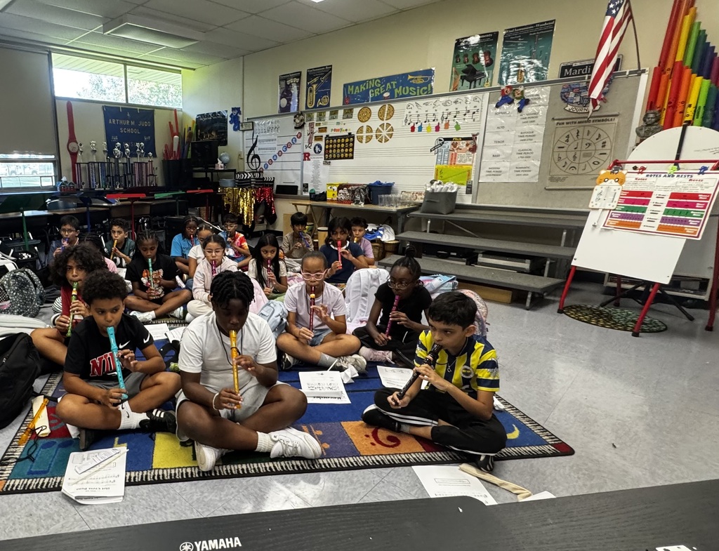 Students play recorder 