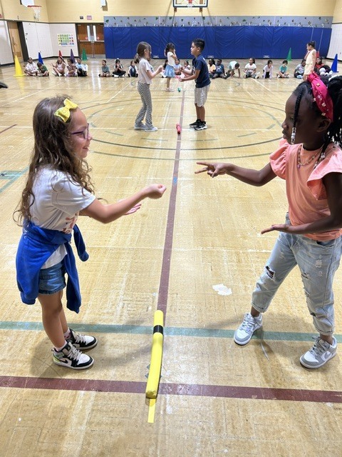 Students playing rock paper scissors