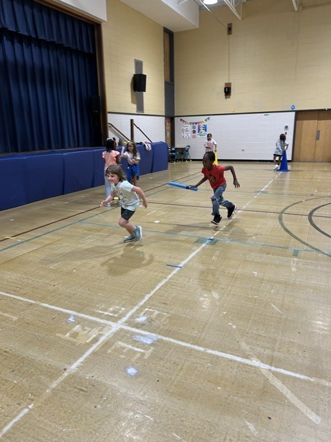 Students playing rock paper scissors
