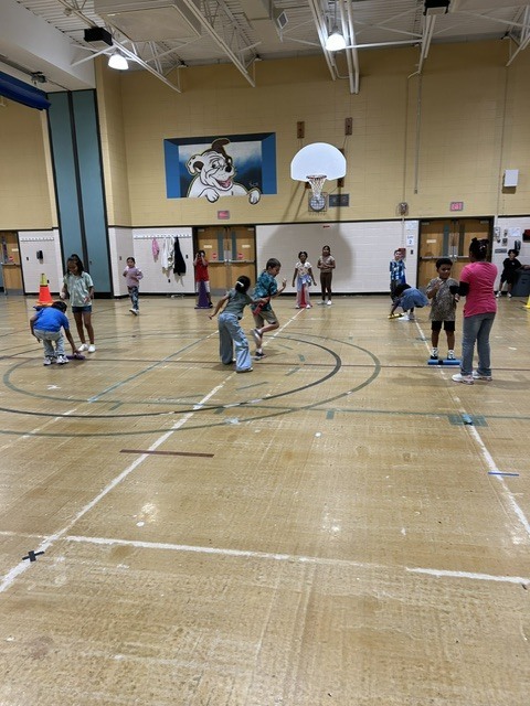 Students playing rock paper scissors
