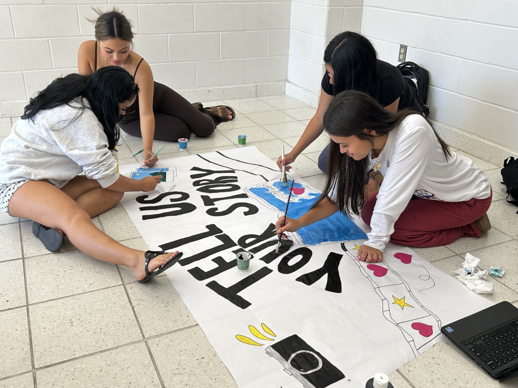 Students working on posters