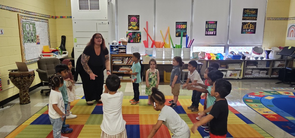 music class of students with their teacher