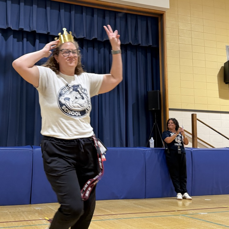 staff member holding up a peace sign