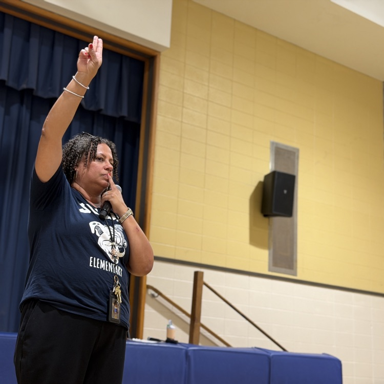 silent signal practice being modeled by staff member