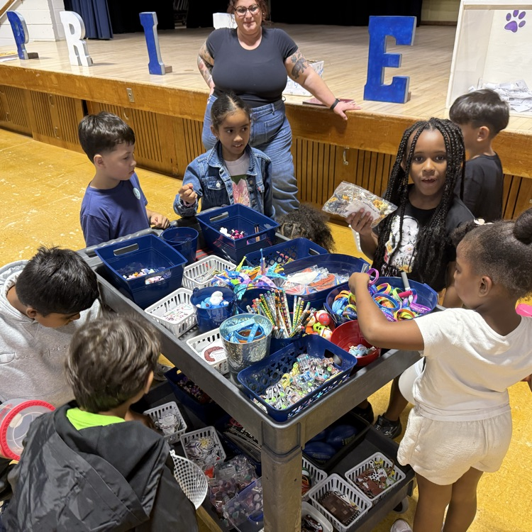 Students choosing prizes from a cart