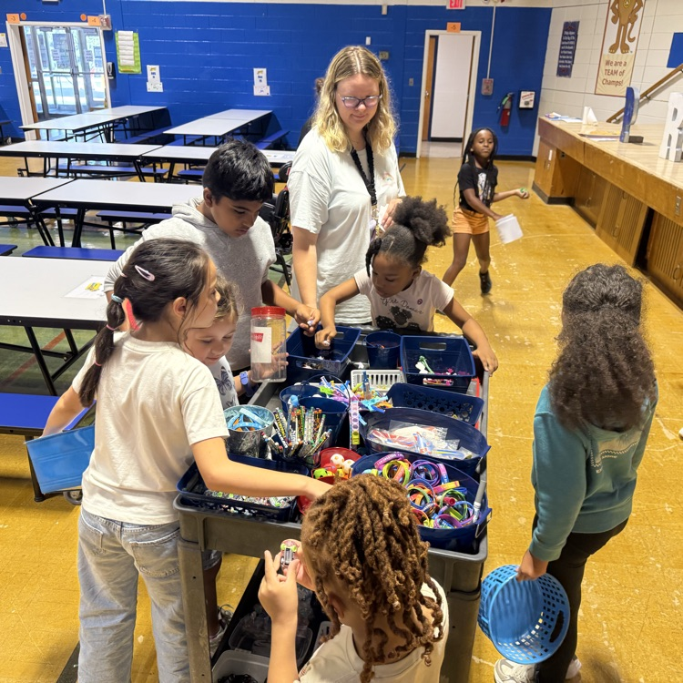 Students choosing prizes from a cart