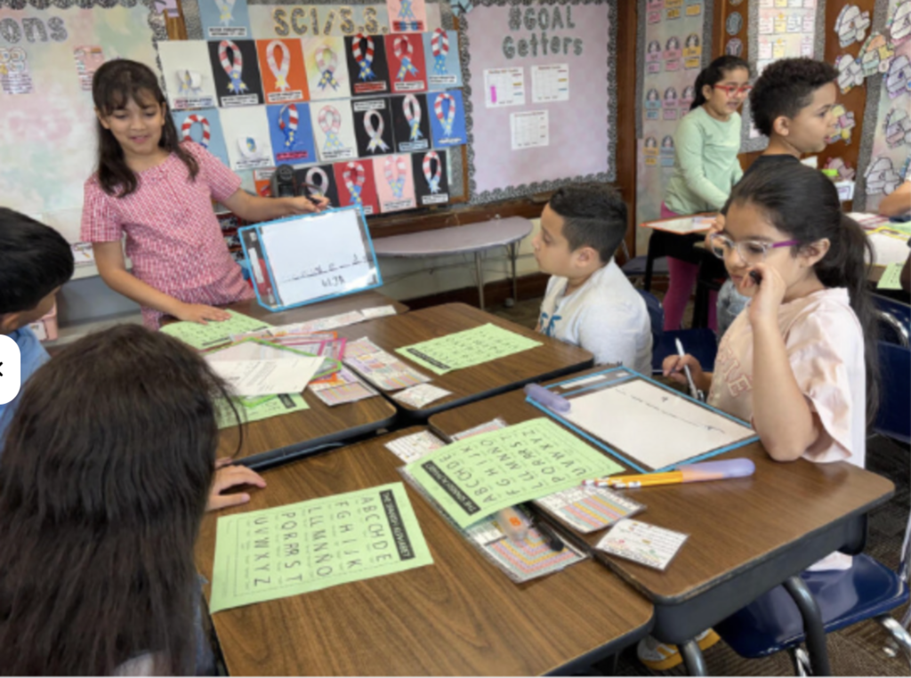 Students playing word game at table