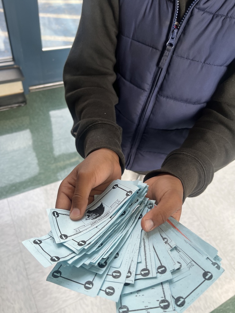 Student holding fake money