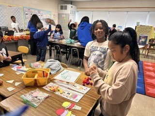 Students working on math activity at a table