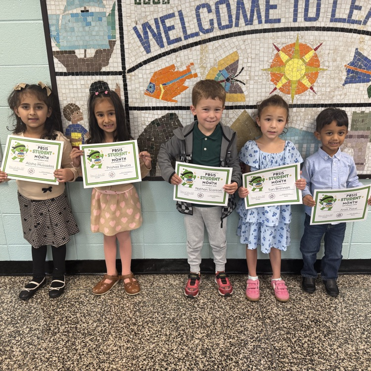 Students holding certificates